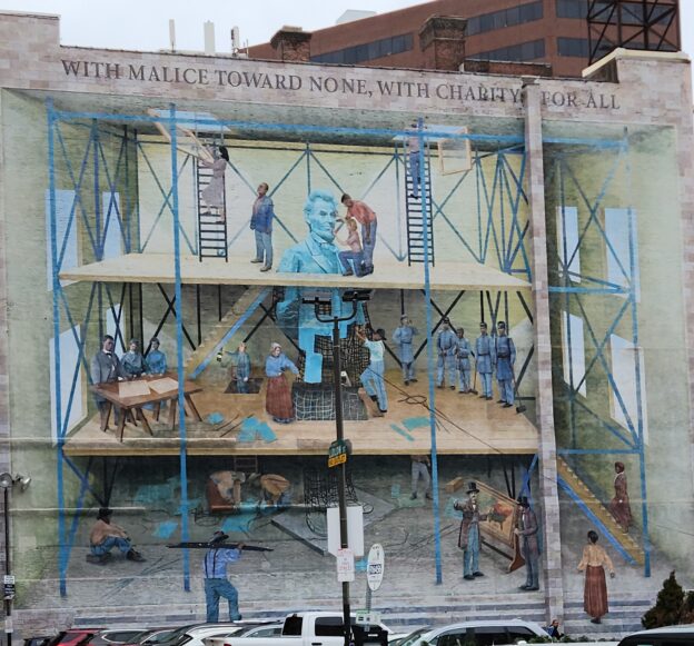 "With malice toward none; with charity toward all," a 2007 mural inspired by Abraham Lincoln, created by Jared Bader in Philadelphia. Photo February 2025.